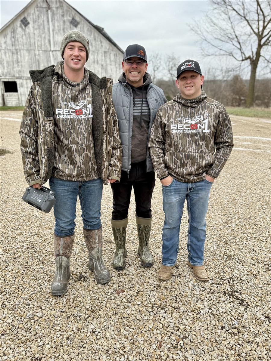 Recon1 crew in branded gear at a property before a herd analysis flight